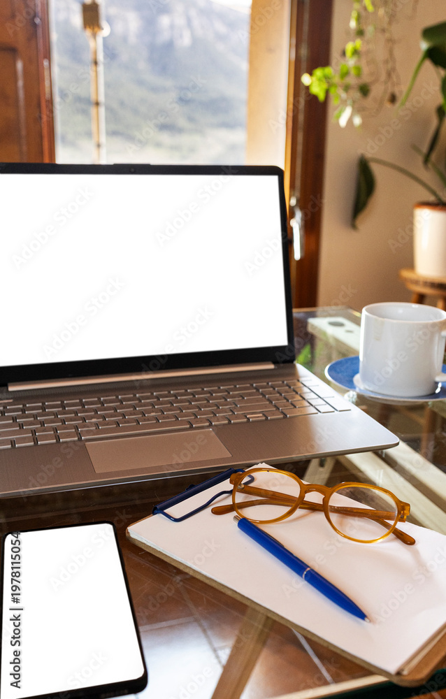 Obraz premium Laptop and notebook creating remote working from home office