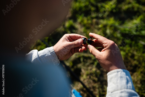 Quadro su tela Farmer holding watering drip irrigation emitter outdoors