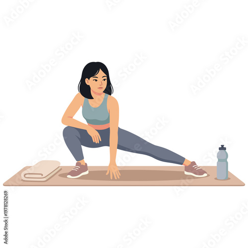 Woman stretching on a mat with a bottle and towel nearby indoors