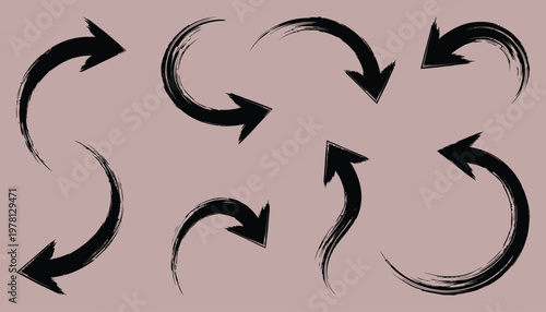 Various black arrows in circular patterns on a gray background