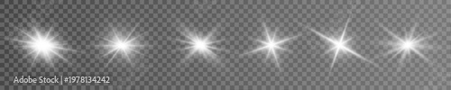 Magic stars flare shines with soft golden white glow. Spark particles drift slowly around radiant center core. Ideal for Christmas graphics use.