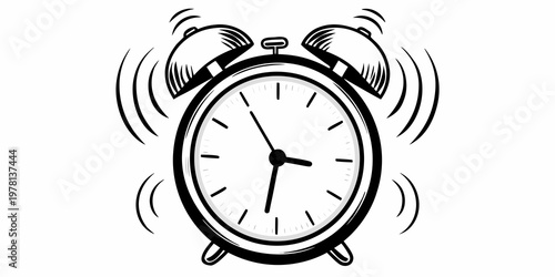 A classic black and white alarm clock is ringing loudly