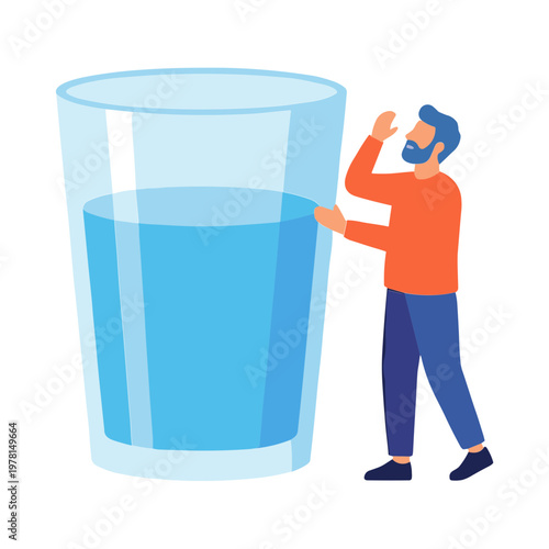 A man is standing next to a large glass of water and gesturing.