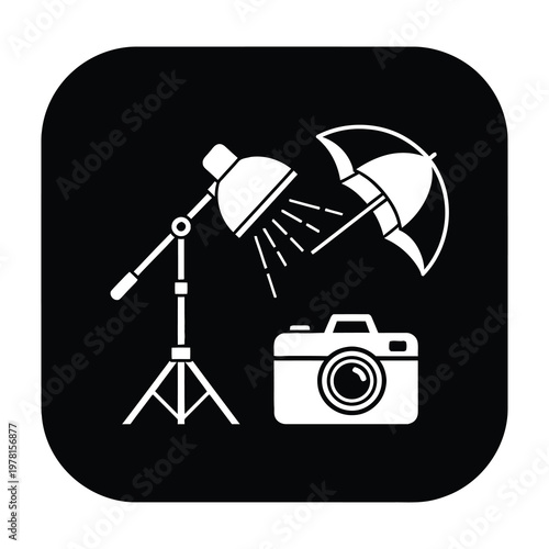 Studio photography equipment with camera and softbox lights on tripod