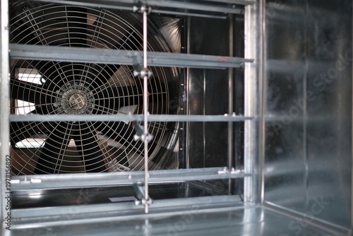 Close-up shot of flaps of fire, volume damper and ventilation fan.