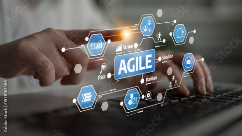 Konstfotografi A business professional interacts with digital tools that showcase agile concepts like Scrum and Kanban, emphasizing teamwork and innovative project management strategies