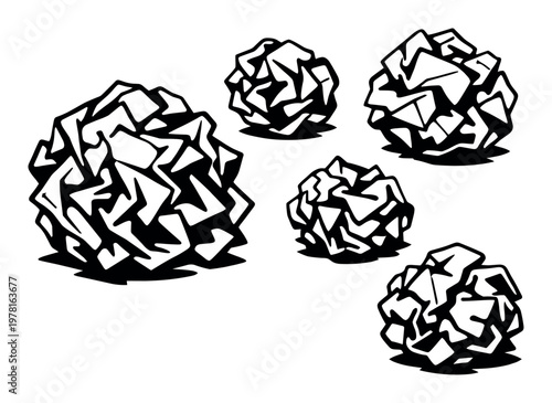 Crumpled paper balls creating a graphic representation of mistakes, waste, and failed attempts in a creative or problem-solving process