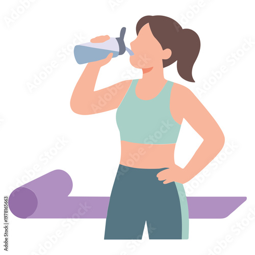 A woman in sportswear drinking from a bottle on a yoga mat indoors