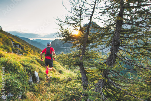 Trail Runner at Sunrise in Alpine Mountains