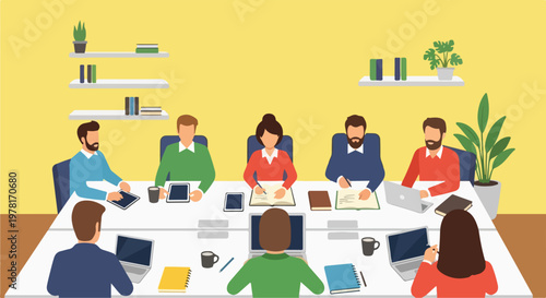 A team of professional men and women are gathered around a long office table for a productive business meeting in a modern workspace.
