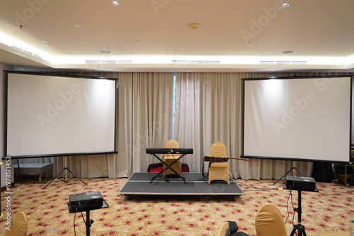 a professional indoor setup for a small event or presentation, likely in a hotel ballroom or conference room.