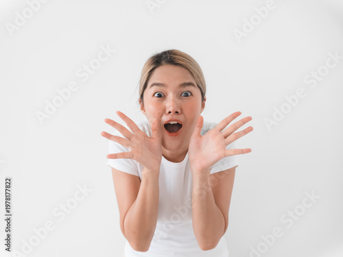 Closeup of enthusiastic woman with hands around face and wide eyes