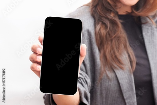 Fotografija Hand holds smartphone, screen blank and ready