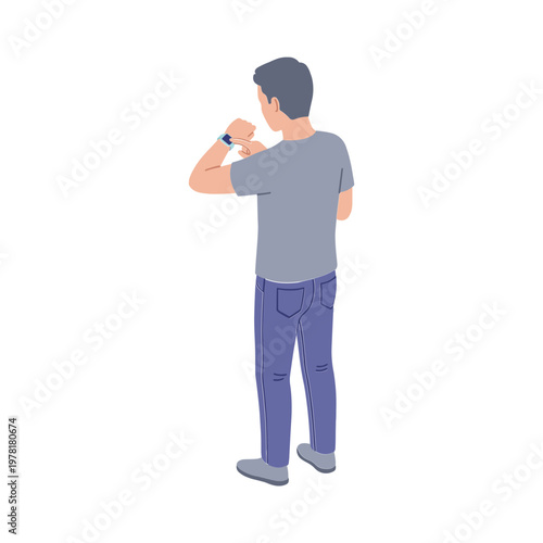 Man wearing watch on left arm standing alone indoors looking at device