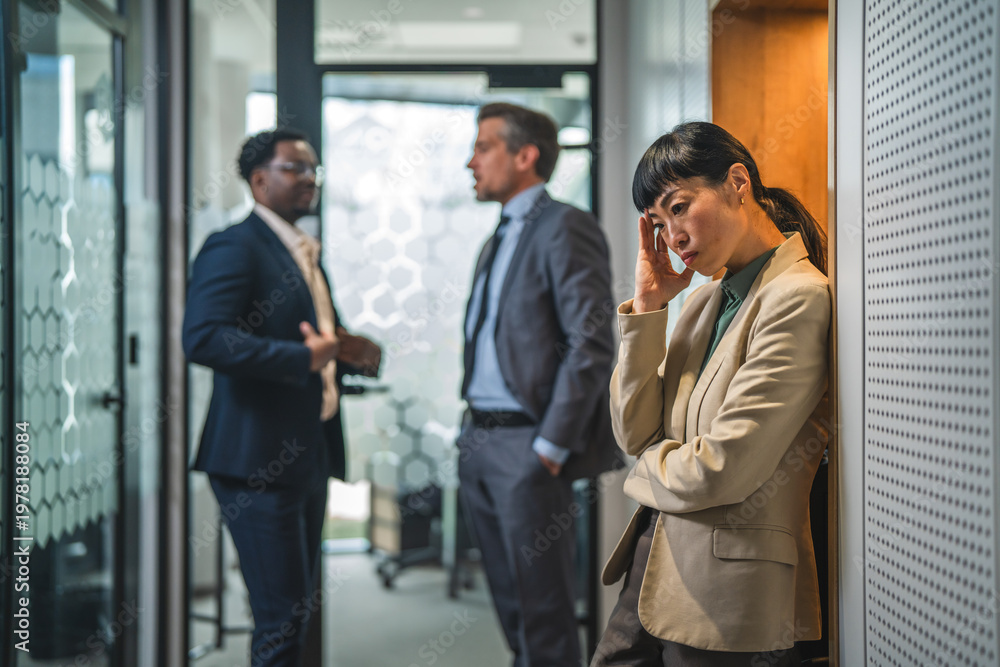 Fototapeta premium Stressed businesswoman experiencing workplace bullying or burnout in office