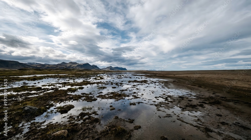 Fototapeta premium Wet land surface reflecting sky creating surreal mirror illusion landscape for abstract nature concept