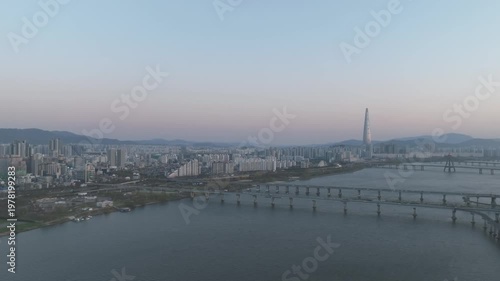 Aerial night view of the illuminated Seoul skyline and Han River from Gwangjin-gu, South Korea.