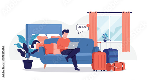 Professional man working on a laptop while sitting on a sofa in a hotel room with suitcases packed and ready for an upcoming travel trip.