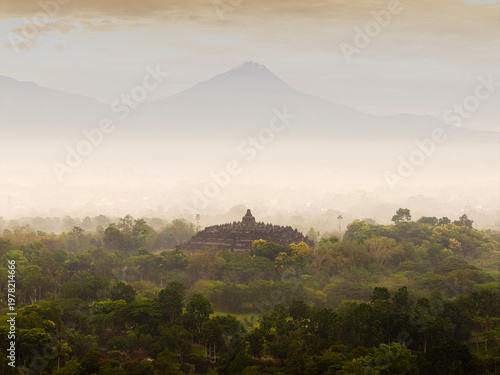 Borobudur temple with Mount Merapi in background at sunrise, Indonesia
