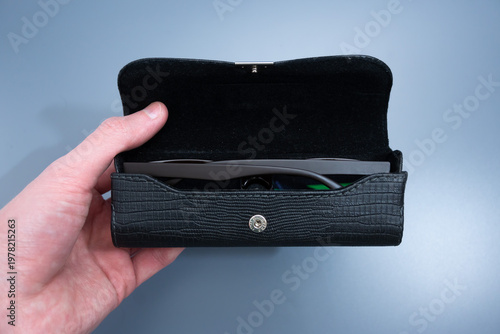 Black Leather Eyeglasses Case in Hand