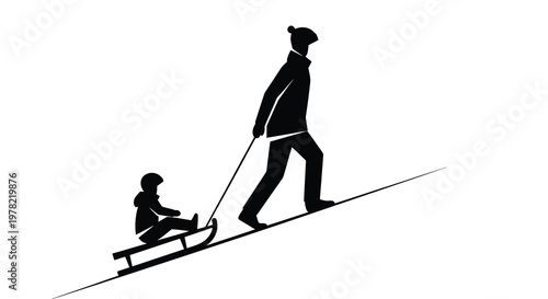 Silhouette of a father pulling a child on a sled during winter