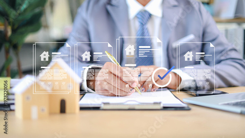 Real estate agent signing property contract with digital document overlay, showcasing home approval, mortgage agreement, and secure transaction in modern business environment.