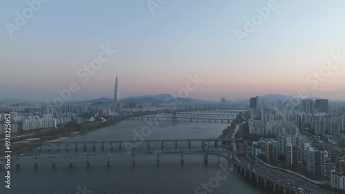 Aerial night view of the illuminated Seoul skyline and Han River from Gwangjin-gu, South Korea.