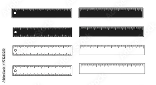 Collection of black and white rulers with varying scales and hole placements