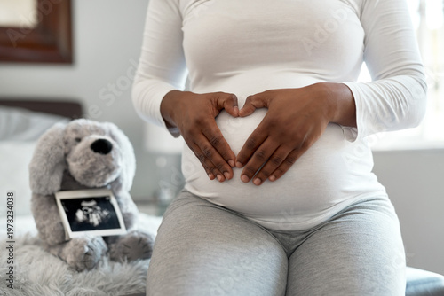 фотографія Pregnant woman, hands or stomach with sonogram in home or nursery for ultrasound or motherhood