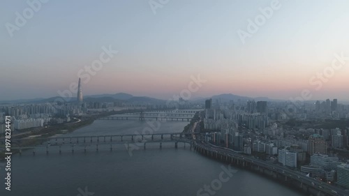 Aerial night view of the illuminated Seoul skyline and Han River from Gwangjin-gu, South Korea.