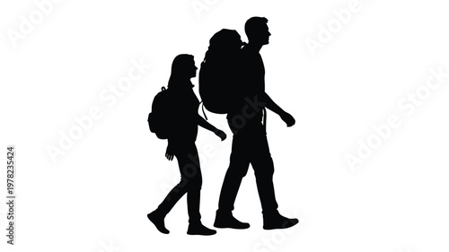 Couple hiking with backpacks captured in a stark black silhouette