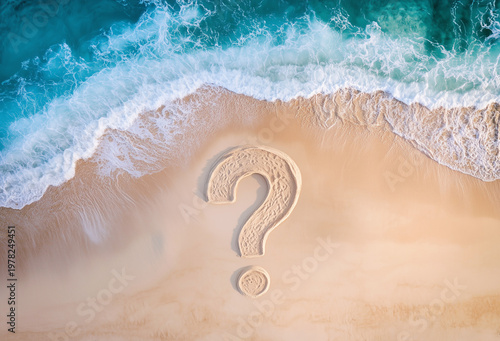 Question mark drawn on sand next to sea wave, top view.