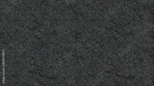 High resolution image of a dark grey rock texture with detailed grains