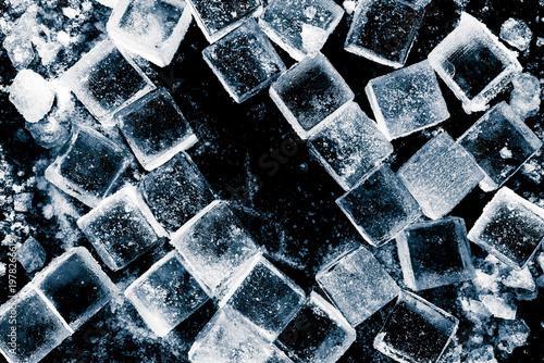 Ice cubes with a ice crush and snow on black background