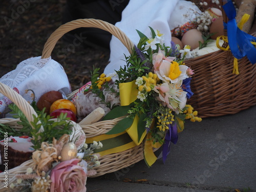 Detailed view of decorated traditional polish easter basket with colorful flowers and eggs