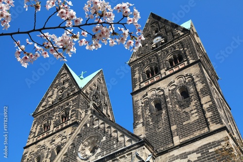 Church in Krefeld, Germany. Spring time cherry blossoms.
