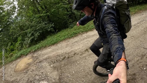 Man Riding Unicycle On Forest Road With Backpack Slow Motion