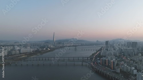 Aerial night view of the illuminated Seoul skyline and Han River from Gwangjin-gu, South Korea.