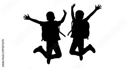 Two joyful children leaping in the air a dark silhouette