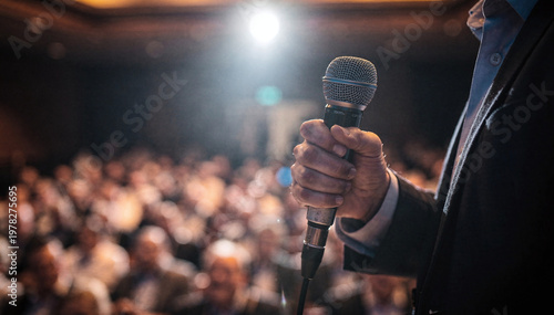 Speaker Hand Hold Microphone at Business Seminar or Executive Conference