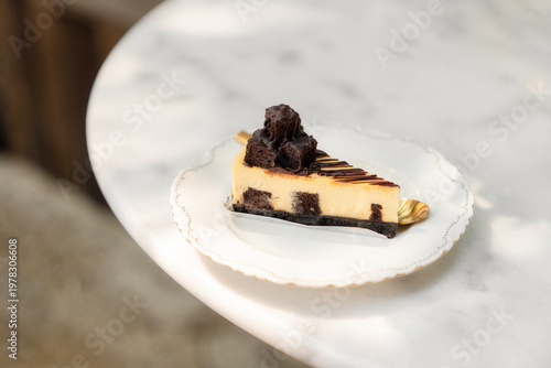 Chocolate Brownie Cheesecake Slice on Marble Table