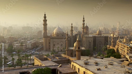 Wallpaper Mural Majestic Sultan Hassan mosque in old Cairo, Egypt. Evening sunlight falls over the historic district of Cairo, Egyptian capital. Zoom out shot Torontodigital.ca