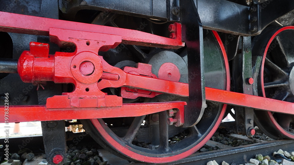 Fototapeta premium Classic steam train bogie featuring large diameter wheels and mechanical pistons