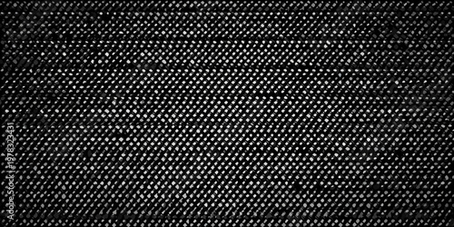 Close up of a dark textured surface resembling woven netting or fabric