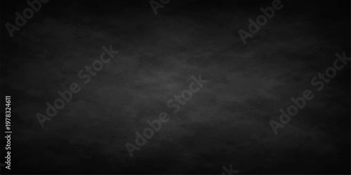 Abstract the photograph features a full frame composition of dark gray texture and subtle grunge details create a sleek modern backdrop, adding depth and dimension to any creative project.