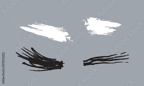 Grunge paint brush strokes vector set, black and white ink splatters on grey background, hand drawn artistic textured smears for graphic design