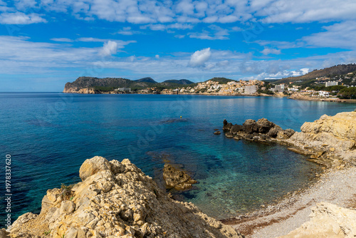 Panoramic view of turquoise bay and rocky coastline in Peguera Mallorca with clear water 