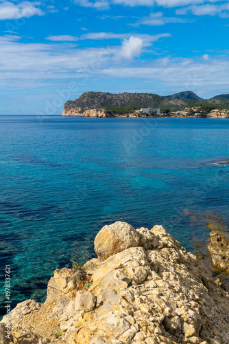 Panoramic view of turquoise bay and rocky coastline in Peguera Mallorca with clear water 