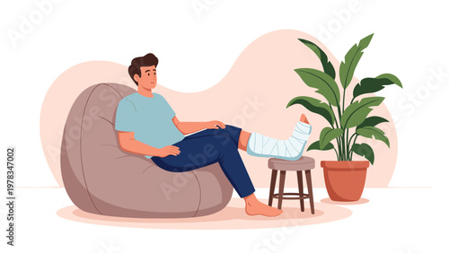 Injured man sitting in a comfortable bean bag chair at home while resting his leg in a medical cast on a small stool for recovery.