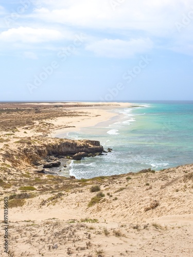 Beach and cliffs on the Atlantic coast. Clear day. Boa Vista Island, Cape Verde.